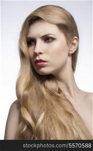 beauty shoot of beautiful woman with very long cute blonde hair, elegant hair-style. Extension