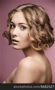 beauty shoot of pretty girl with short curly blonde hair-cut and natural make-up.