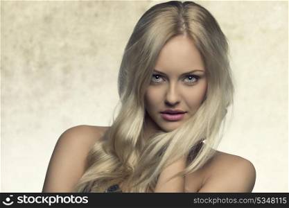 beauty shoot of sexy blonde girl with perfect skin, natural style and free silky blonde hair