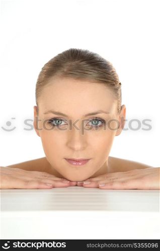 Beauty shot of a woman&rsquo;s face and hands