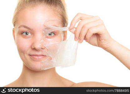 Beauty skin care cosmetics and health concept. Closeup young woman face, girl removing facial peel off mask isolated on white. Peeling