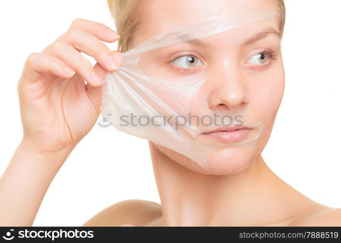 Beauty skin care cosmetics and health concept. Closeup young woman face, girl removing facial peel off mask isolated on white. Peeling