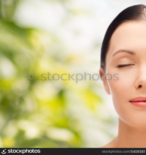 beauty, spa and health concept - relaxed young woman with closed eyes