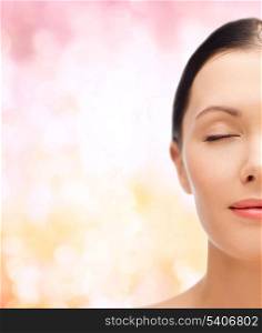 beauty, spa and health concept - relaxed young woman with closed eyes