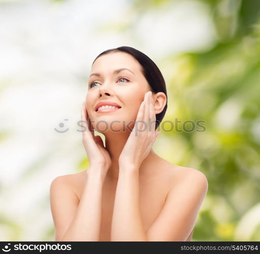 beauty, spa and health concept - smiling young woman