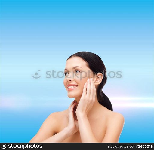 beauty, spa and health concept - smiling young woman