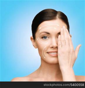 beauty, spa and health concept - smiling young woman covering half of face with hand