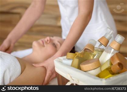 Beauty spa products in massage room woman enjoy treatment