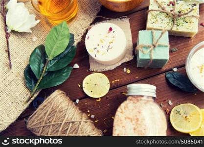beauty, spa, therapy, natural cosmetics and wellness concept - close up of body care cosmetic products on wood. close up of body care cosmetic products on wood. close up of body care cosmetic products on wood