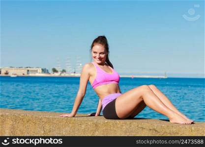 Beauty sporty slim girl training outdoor. Young attractive happy girl posing in sports clothing.. Attractive sporty girl outdoor