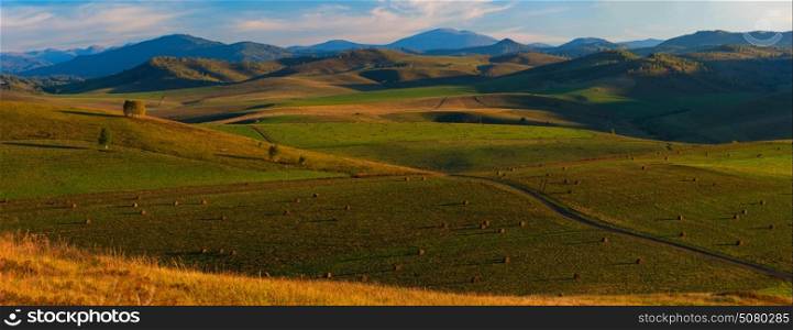Beauty summer evening in the mountains in Altay, panoramic picture. Beauty summer evening in the mountains