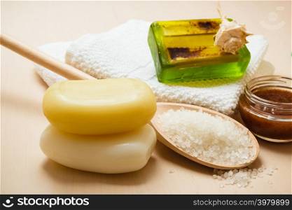 Beauty treatment therapy and skin care. Closeup spa products some bath accessories on wooden table.