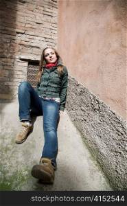 Beauty Under The Sunlight. Young Beauty Woman Laying On Concrete Wall. Old Italy Series.