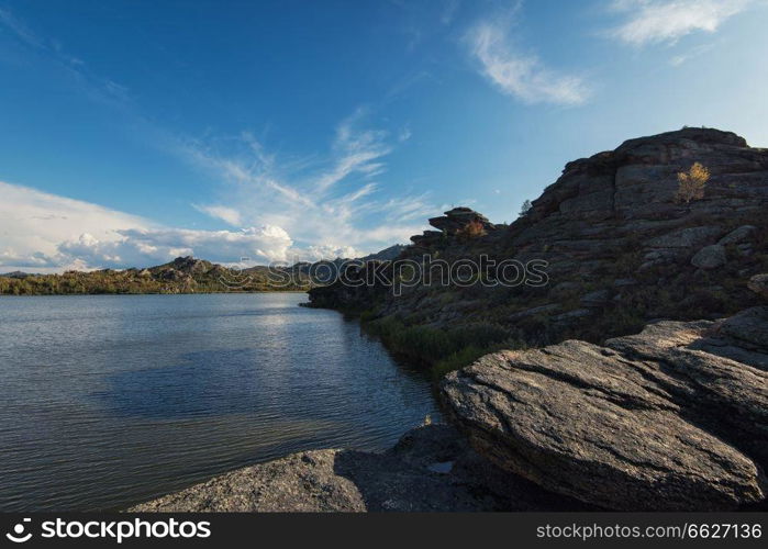 Beauty view on Kolyvan lake - a lake at the foot of the northern slope of the Kolyvan Ridge in the Altai Territory of Russia. Beauty view on Kolyvan lake