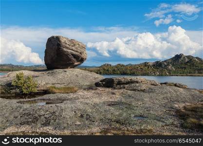 Beauty view on Kolyvan lake. Bizarre forms of weathering of coastal rocks at the Kolyvan lake - a lake at the foot of the northern slope of the Kolyvan Ridge in the Altai Territory of Russia.
