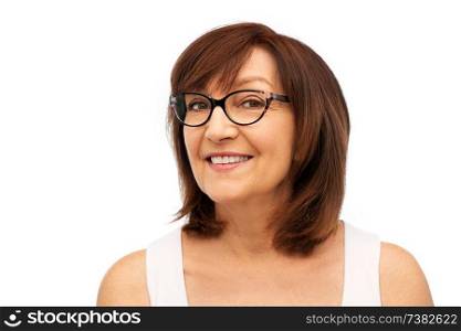 beauty, vision and old people concept - portrait of smiling senior woman in glasses over white background. portrait of senior woman in glasses over white