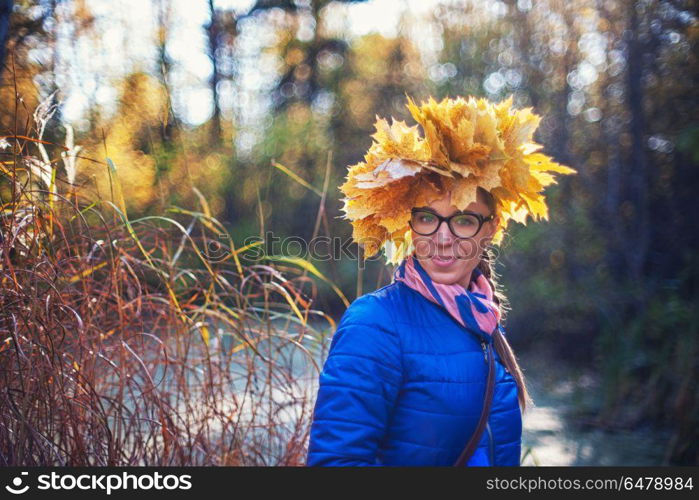 Beauty woman at autumn park. Beauty woman at autumn park in sunny beauty day