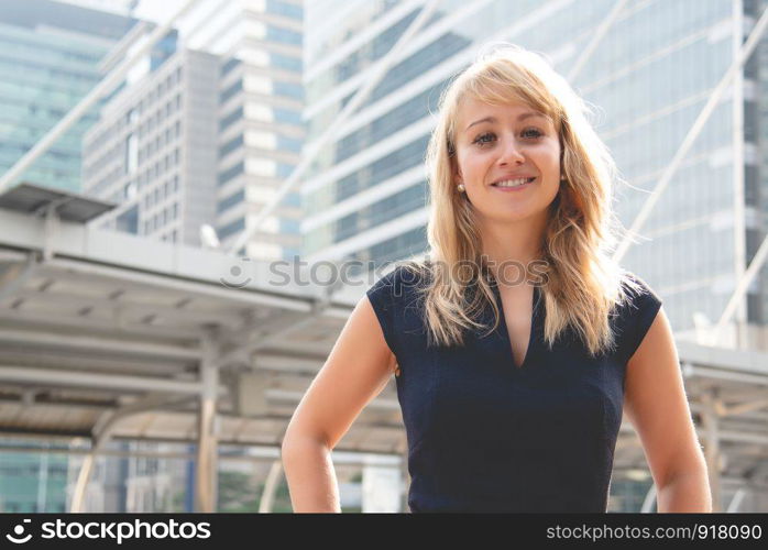 Beauty woman portrait with city and building background. Happy life of people concept. Smiling lady theme.