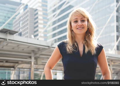 Beauty woman portrait with city and building background. Happy life of people concept. Smiling lady theme.