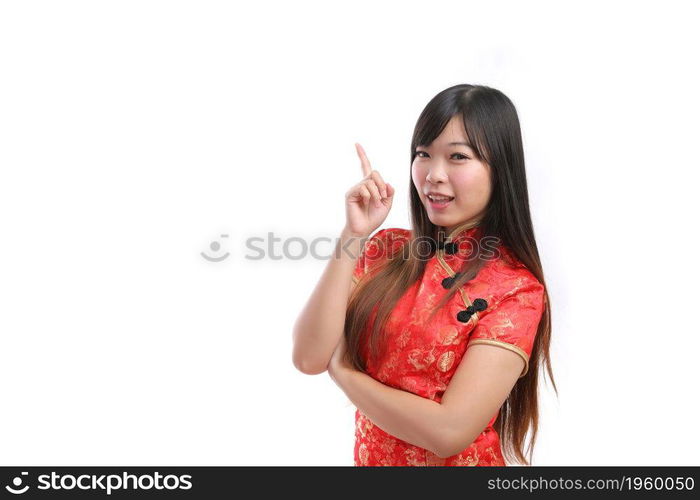 beauty woman wear red cheongsam point and smile in chinese new year