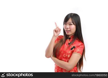 beauty woman wear red cheongsam point and smile in chinese new year