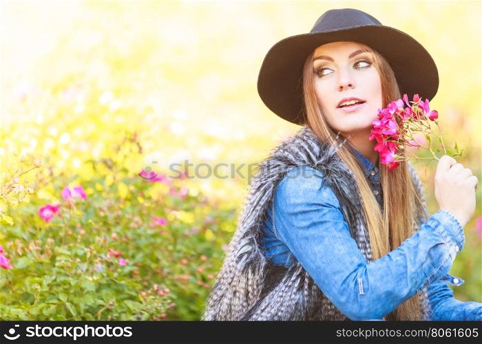 Beauty woman with flowers. Freedom and leisure. Gorgeous adorable woman holding pink flowers. Romantic portrait of beautiful young lady.