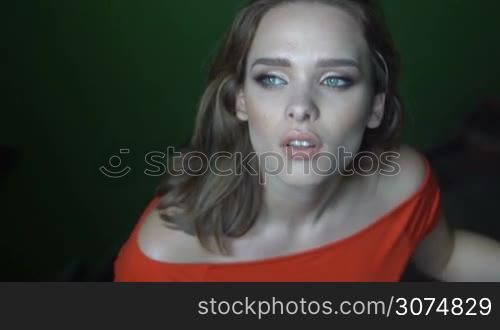 Beauty woman with mesmerising eyes and red dress