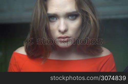 Beauty woman with mesmerising eyes and red dress