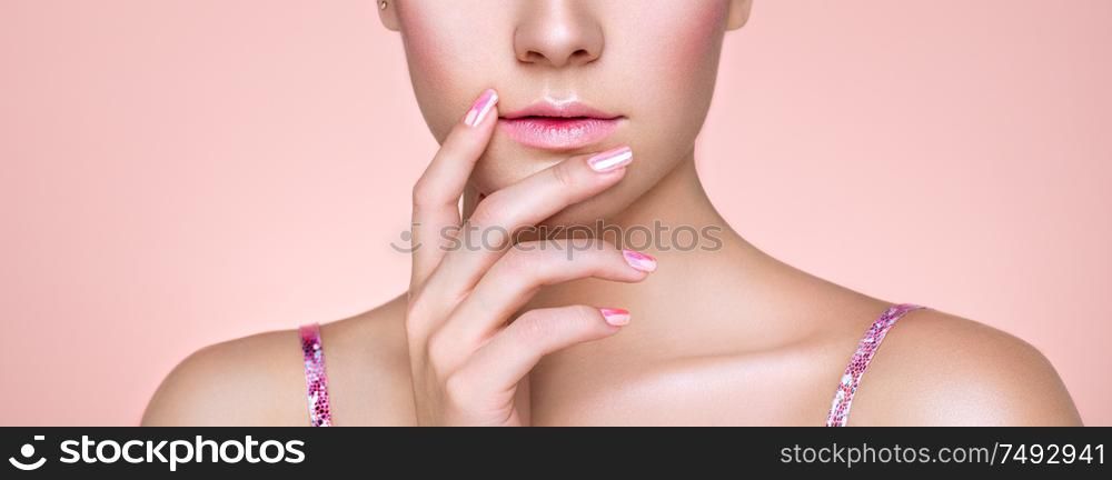 Beauty Woman with perfect Makeup and Manicure. Pink Lips and Nails. Beauty girls Face isolated on light Background. Fashion photo
