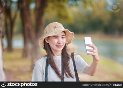 Beauty women selfie with smart phone travel take photo