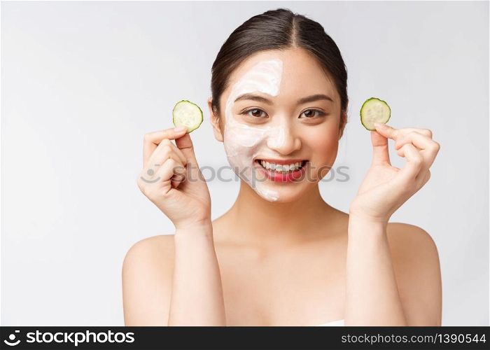 Beauty young asian women skin care image with cucumber on white background studio.. Beauty young asian women skin care image with cucumber on white background studio