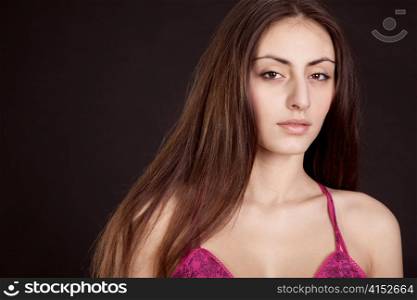 Beauty young girl face on dark background