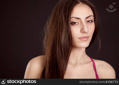 Beauty young girl face on dark background