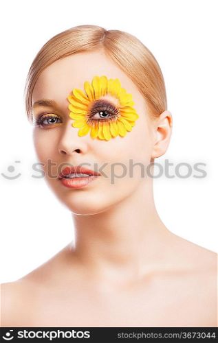 beauty young girl with a floral makeup. She looks in to the lens and her mouth is sligthly open.