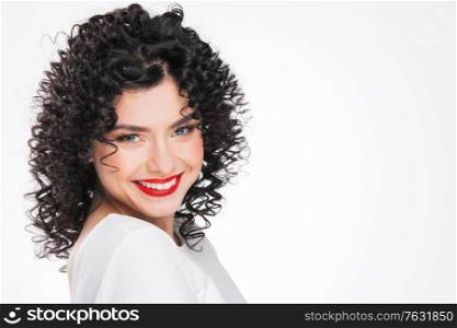 Beauty young woman portrait isolated on white background. Girl with black curly hair. Hairstyle. Haircut. Model girl with curly hair