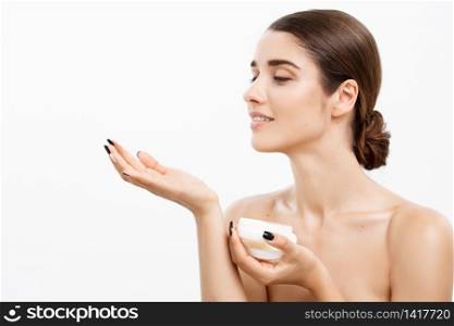 Beauty Youth Skin Care Concept - Beautiful Caucasian Woman Face Portrait smiling and holding cream jar for body and skin.Isolated over white background. Beauty Youth Skin Care Concept - Beautiful Caucasian Woman Face Portrait smiling and holding cream jar for body and skin.Isolated over white background.