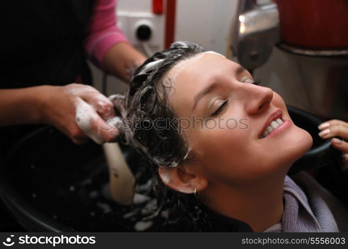 Beautyful young woman enjoying a hair-wash