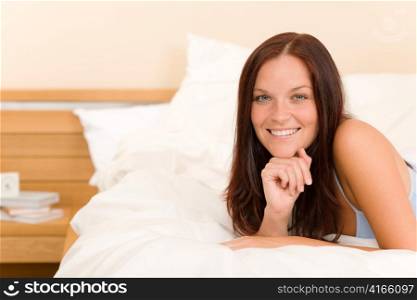 Bedroom - beautiful woman morning waking up lying on white bed