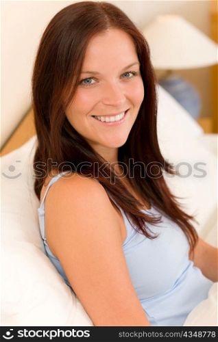 Bedroom - beautiful woman morning waking up sitting on white bed