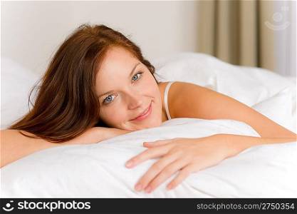Bedroom - happy woman in white bed waking up