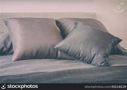 bedroom interior with decorative grey pillows on bed -vintage style effect
