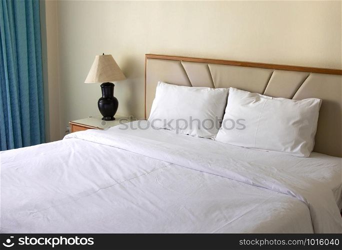 bedroom interior with pillow and table lamp