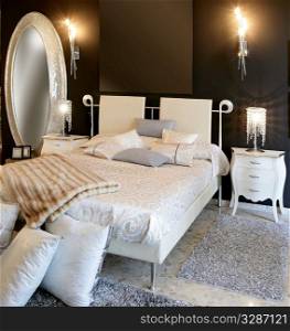 bedroom modern silver oval mirror white bed black wall