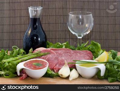 beef and salad. a background food composition with beef, wine and salad