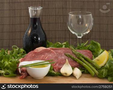 Beef and salad with wine. a background food composition with beef, wine and salad