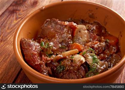 Beef bourguigno - dish originates from Burgundy region (in French, Bourgogne) ?stew prepared with beef braised in red wine.farm-style
