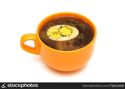 Beef broth with egg on white background