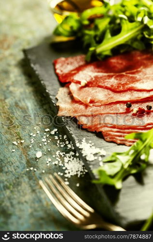 Beef Carpaccio on dark background