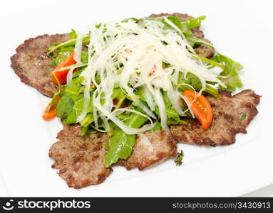 beef chops with arucola and grated cheese Parmesan