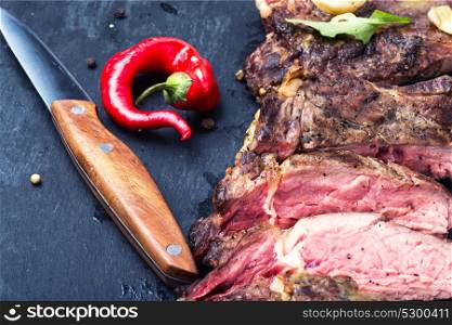 beef grilled steak. Grilled beef steak sliced on cutting board